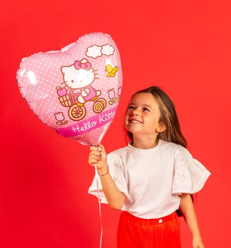 Foliový balonek srdce - Hello Kitty na kole 46cm